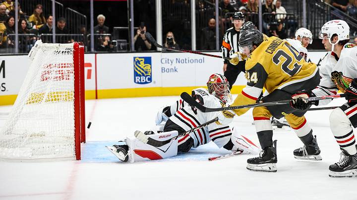Vegas Golden Knights' Trevor Connelly (24) scores his first NHL goal against Chicago Blackhawks goaltender Spencer Knight (30) during the first period at T-Mobile Arena.  Mandatory Credit: Christopher Trim-Imagn Images
