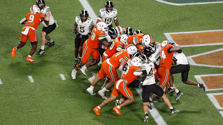 Dec 28, 2024; Orlando, FL, USA; Miami Hurricanes running back Mark Fletcher Jr. (4) scores a touchdown against the Iowa State Cyclones in the third quarter during the Pop Tarts bowl at Camping World Stadium. Mandatory Credit: Nathan Ray Seebeck-Imagn Images