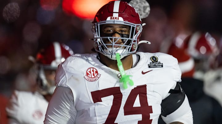 Dec 19, 2025; Norman, OK, USA; Alabama Crimson Tide offensive lineman Kadyn Proctor (74) against the Oklahoma Sooners during the CFP National Playoff First Round at Gaylord Family Oklahoma Memorial Stadium.