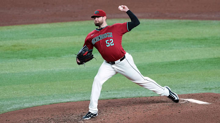 May 25, 2024; Phoenix, Arizona, USA; Arizona Diamondbacks pitcher Jordan Montgomery (52) pitches against the Miami Marlins during the sixth inning at Chase Field. Mandatory Credit: Joe Camporeale-Imagn Images May 25, 2024; Phoenix, Arizona, USA; Arizona Diamondbacks pitcher Jordan Montgomery (52) pitches against the Miami Marlins during the sixth inning at Chase Field. Mandatory Credit: Joe Camporeale-Imagn Images