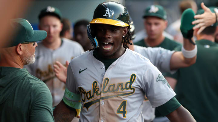 Jul 25, 2024; Anaheim, California, USA; Oakland Athletics right fielder Lawrence Butler (4) is greeted by teammates in the dugout after hitting a home run during the third inning against the Los Angeles Angels at Angel Stadium. Mandatory Credit: Kiyoshi Mio-USA TODAY Sports Jul 25, 2024; Anaheim, California, USA; Oakland Athletics right fielder Lawrence Butler (4) is greeted by teammates in the dugout after hitting a home run during the third inning against the Los Angeles Angels at Angel Stadium. Mandatory Credit: Kiyoshi Mio-USA TODAY Sports