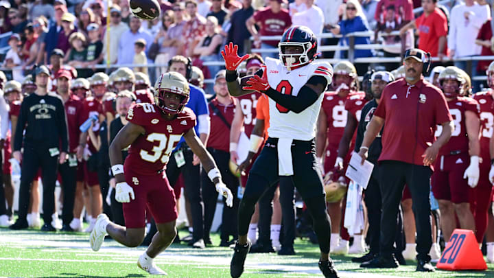 Sep 28, 2024; Chestnut Hill, Massachusetts, USA; Western Kentucky Hilltoppers wide receiver Kisean Johnson (0) tries to make a catch with pressure from Boston College Eagles defensive back Ashton McShane (35) during the second half at Alumni Stadium. Mandatory Credit: Eric Canha-Imagn Images Sep 28, 2024; Chestnut Hill, Massachusetts, USA; Western Kentucky Hilltoppers wide receiver Kisean Johnson (0) tries to make a catch with pressure from Boston College Eagles defensive back Ashton McShane (35) during the second half at Alumni Stadium. Mandatory Credit: Eric Canha-Imagn Images