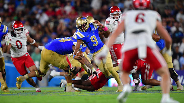 Aug 30, 2025; Pasadena, California, USA; UCLA Bruins quarterback Nico Iamaleava (9) runs the ball against the Utah Utes during the first half at Rose Bowl. Mandatory Credit: Gary A. Vasquez-Imagn Images