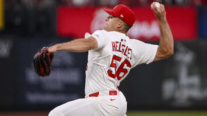 Mar 27, 2025; St. Louis, Missouri, USA;  St. Louis Cardinals relief pitcher Ryan Helsley (56) pitches against the Minnesota Twins during the ninth inning at Busch Stadium.