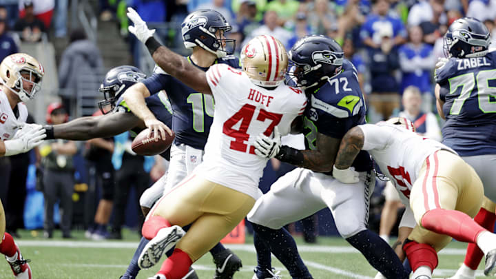 Sep 7, 2025; Seattle, Washington, USA; Seattle Seahawks quarterback Sam Darnold (14) looks to make a pass against San Francisco 49ers during the first half at Lumen Field. Mandatory Credit: Joe Nicholson-Imagn Images
