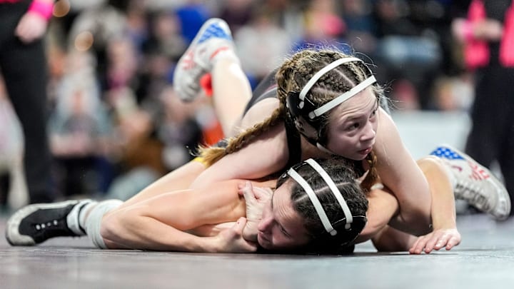 Denver’s Abigail Peterson (top) won the 100-pound Iowa girls wrestling state championship on Feb. 6, 2026. Denver’s Abigail Peterson (top) won the 100-pound Iowa girls wrestling state championship on Feb. 6, 2026.