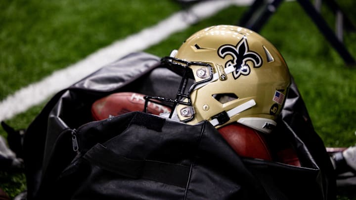 Nov 5, 2023; New Orleans, Louisiana, USA;  Detailed view of the New Orleans Saints helmet and ball bag against the Chicago Bears during the first half at the Caesars Superdome. Mandatory Credit: Stephen Lew-Imagn Images