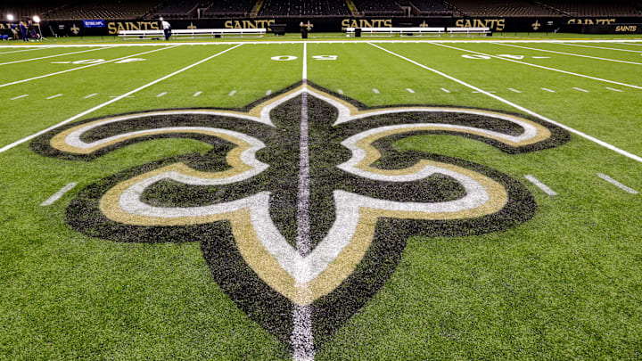 Oct 30, 2022; New Orleans, Louisiana, USA; General view of the New Orleans Saints logo as the midfield logo fleur-de-lis after the game between the New Orleans Saints and the Las Vegas Raiders at Caesars Superdome. Mandatory Credit: Stephen Lew-Imagn Images Oct 30, 2022; New Orleans, Louisiana, USA; General view of the New Orleans Saints logo as the midfield logo fleur-de-lis after the game between the New Orleans Saints and the Las Vegas Raiders at Caesars Superdome. Mandatory Credit: Stephen Lew-Imagn Images