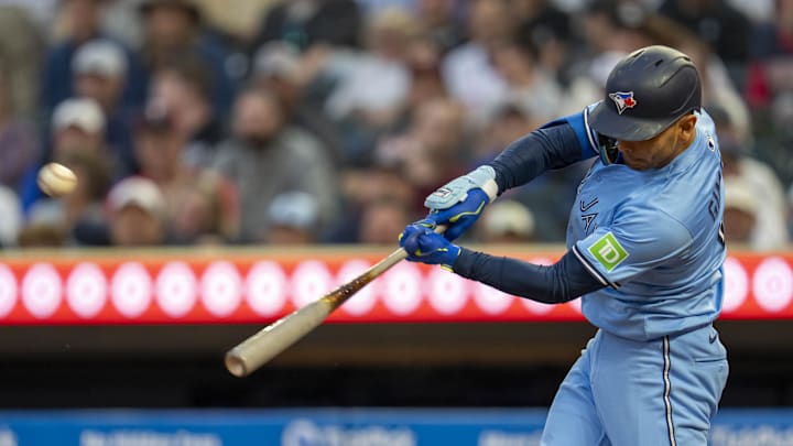 Minneapolis, Minnesota, USA; Toronto Blue Jays second baseman Andres Gimenez (0) hits a double against the Minnesota Twins in the fifth inning at Target Field.