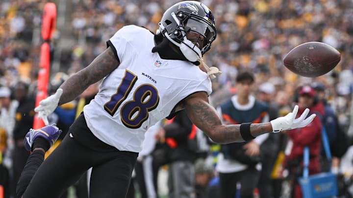 Nov 17, 2024; Pittsburgh, Pennsylvania, USA; Baltimore Ravens wide receiver Diontae Johnson (18) reaches for an incomplete pass against the Pittsburgh Steelers during the first quarter at Acrisure Stadium. Mandatory Credit: Barry Reeger-Imagn Images