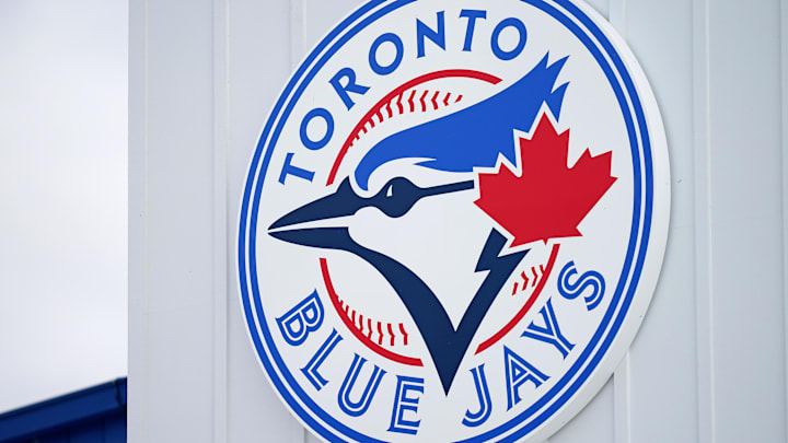A detailed view of the Toronto Blue Jays logo on a building at TD Ballpark. 