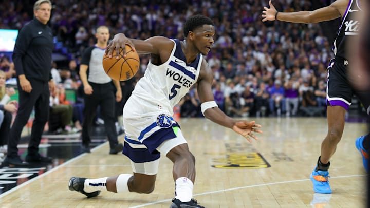 Oct 24, 2024; Sacramento, California, USA;Minnesota Timberwolves guard Anthony Edwards (5) dribbles the ball against Sacramento Kings guard De'Aaron Fox (5) during the fourth quarter at Golden 1 Center. Mandatory Credit: Sergio Estrada-Imagn Images