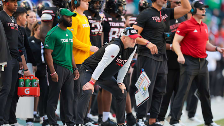 Jan 1, 2026; Miami Gardens, FL, USA; Texas Tech Red Raiders head coach Joey McGuire looks on from the sidelines against the Oregon Ducks during the second half of the 2025 Orange Bowl and quarterfinal game of the College Football Playoff at Hard Rock Stadium. Mandatory Credit: Sam Navarro-Imagn Images Jan 1, 2026; Miami Gardens, FL, USA; Texas Tech Red Raiders head coach Joey McGuire looks on from the sidelines against the Oregon Ducks during the second half of the 2025 Orange Bowl and quarterfinal game of the College Football Playoff at Hard Rock Stadium. Mandatory Credit: Sam Navarro-Imagn Images