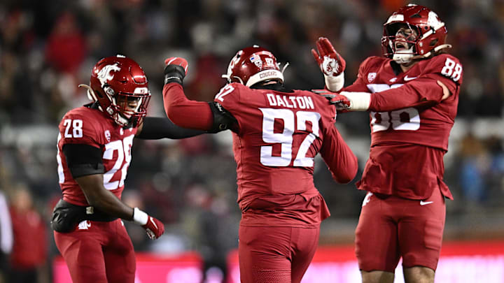 Nov 29, 2025; Pullman, Washington, USA; Washington State Cougars defensive lineman Darrion Dalton (92) celebrates with Washington State Cougars safety Kyle Peterson (28) and Washington State Cougars defensive end Isaac Terrell (88) after a sack against the Oregon State Beavers in the second half at Gesa Field at Martin Stadium. Washington State Cougars won 32-8.