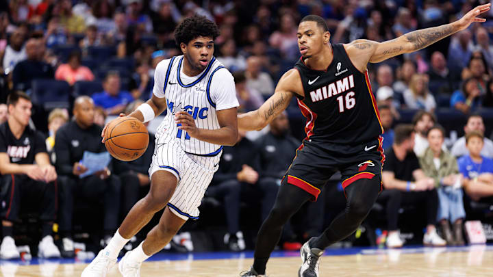 Oct 12, 2025; Orlando, Florida, USA; Orlando Magic guard Jase Richardson (11) drives to the basket while Miami Heat forward Keshad Johnson (16) defends during the second half at Kia Center. Mandatory Credit: Matt Pendleton-Imagn Images Oct 12, 2025; Orlando, Florida, USA; Orlando Magic guard Jase Richardson (11) drives to the basket while Miami Heat forward Keshad Johnson (16) defends during the second half at Kia Center. Mandatory Credit: Matt Pendleton-Imagn Images