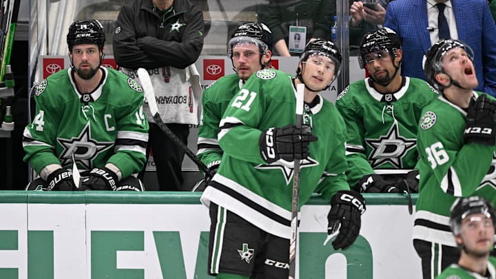 Apr 12, 2025; Dallas, Texas, USA; Dallas Stars left wing Jamie Benn (14) and center Roope Hintz (24) and left wing Jason Robertson (21) and defenseman Matt Dumba (3) and right wing Mikko Rantanen (96) look on as Benn’s goal against the Utah Hockey Club is under review during the third period at the American Airlines Center. Mandatory Credit: Jerome Miron-Imagn Images