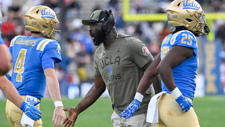 Nov 30, 2024; Pasadena, California, USA; UCLA Bruins head coach DeShaun Foster greets quarterback Ethan Garbers (4) during the third quarter against the Fresno State Bulldogs at Rose Bowl. Mandatory Credit: Robert Hanashiro-Imagn Images