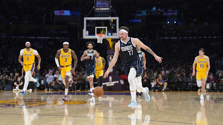 Jan 17, 2024; Los Angeles, California, USA; Dallas Mavericks guard Luka Doncic (77) dribbles the ball against the Los Angeles Lakers in the first half at Crypto.com Arena. Mandatory Credit: Kirby Lee-Imagn Images
