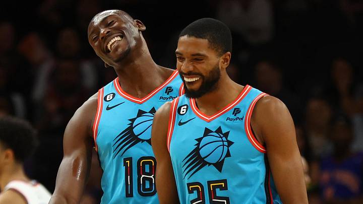 Nov 20, 2022; Phoenix, Arizona, USA; Phoenix Suns center Bismack Biyombo (18) and forward Mikal Bridges (25) celebrate in the fourth quarter against the New York Knicks at Footprint Center. Mandatory Credit: Mark J. Rebilas-Imagn Images