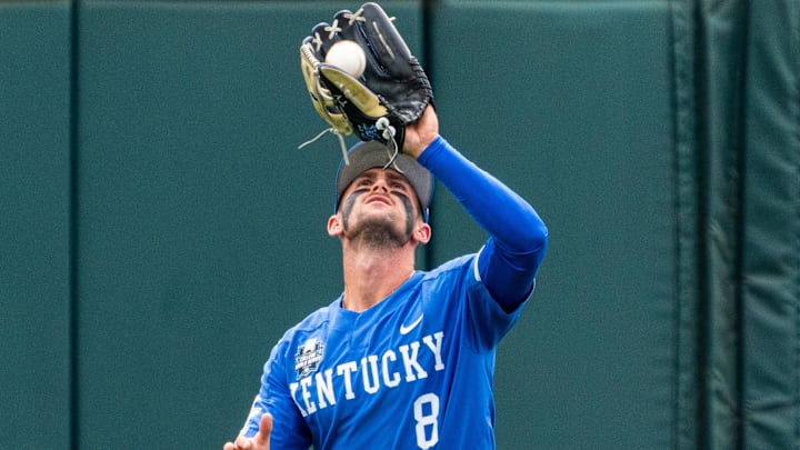Jun 19, 2024; Omaha, NE, USA; Kentucky Wildcats outfielder Ty Crittenberger (8) gets an out against the Florida Gators during the seventh inning at Charles Schwab Field Omaha. Mandatory Credit: Dylan Widger-Imagn Images