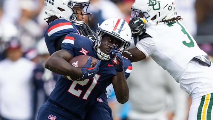 Nov 22, 2025; Tucson, Arizona, USA; Arizona Wildcats running back Ismail Mahdi (21) against the Baylor Bears in the first half at Casino Del Sol Stadium. Mandatory Credit: Mark J. Rebilas-Imagn Images