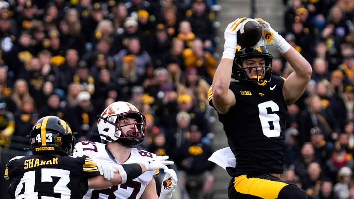 Iowa Hawkeyes defensive back Zach Lutmer (6) intercepts a pass meant for Minnesota Golden Gophers tight end Drew Biber (87) Oct. 25, 2025 at Kinnick Stadium in Iowa City, Iowa. Iowa Hawkeyes defensive back Zach Lutmer (6) intercepts a pass meant for Minnesota Golden Gophers tight end Drew Biber (87) Oct. 25, 2025 at Kinnick Stadium in Iowa City, Iowa.