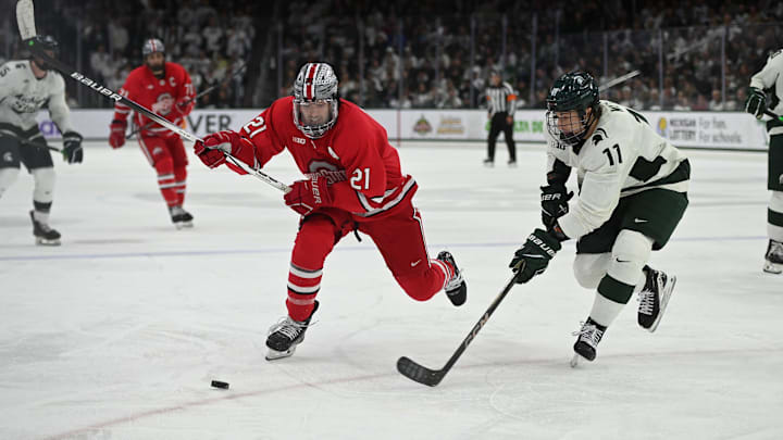 Joe Dunlap defends against MSU's Owen West, Saturday, March 22, 2025, during the third period of the Big 10 Hockey final at Munn Ice Arena. MSU won 4-3 in double overtime.