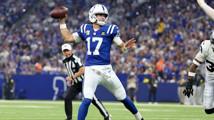 Oct 5, 2025; Indianapolis, Indiana, USA; Indianapolis Colts quarterback Daniel Jones (17) throws a touchdown pass against the Las Vegas Raiders during the second quarter at Lucas Oil Stadium. Mandatory Credit: Trevor Ruszkowski-Imagn Images