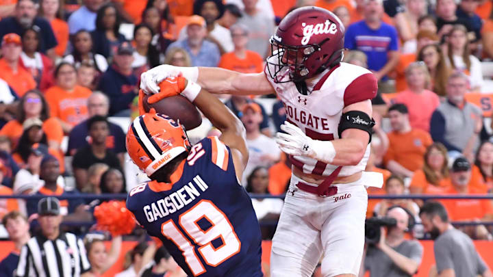 Sep 2, 2023; Syracuse, New York, USA; Syracuse Orange tight end Oronde Gadsden II (19) catches a touchdown as Colgate Raiders defensive back Owen Goss (27) defends in the second quarter at the JMA Wireless Dome. Mandatory Credit: Mark Konezny-USA TODAY Sports