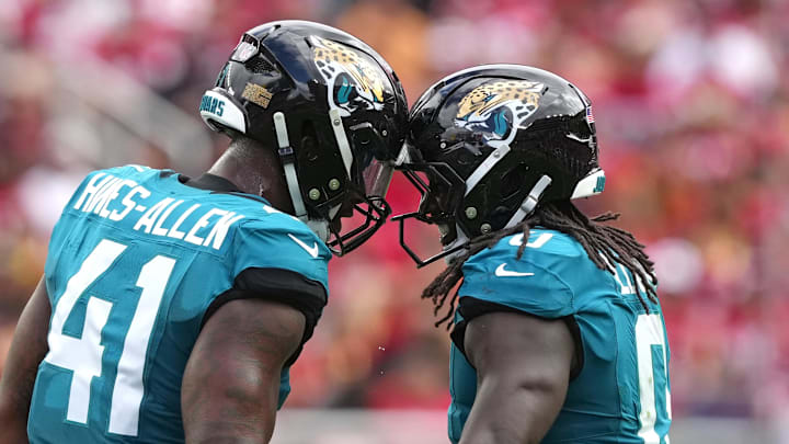 Sep 28, 2025; Santa Clara, California, USA; Jacksonville Jaguars linebacker Devin Lloyd (right) celebrates with defensive end Josh Hines-Allen (41) after intercepting a pass against the San Francisco 49ers during the second quarter at Levi's Stadium. Mandatory Credit: Darren Yamashita-Imagn Images Sep 28, 2025; Santa Clara, California, USA; Jacksonville Jaguars linebacker Devin Lloyd (right) celebrates with defensive end Josh Hines-Allen (41) after intercepting a pass against the San Francisco 49ers during the second quarter at Levi's Stadium. Mandatory Credit: Darren Yamashita-Imagn Images