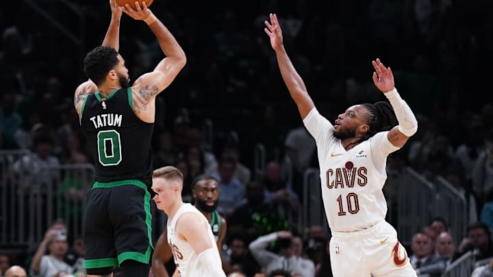 May 15, 2024; Boston, Massachusetts, USA; Boston Celtics forward Jayson Tatum (0) shoots for three points against Cleveland Cavaliers guard Darius Garland (10) in the second quarter during game five of the second round for the 2024 NBA playoffs at TD Garden. Mandatory Credit: David Butler II-Imagn Images