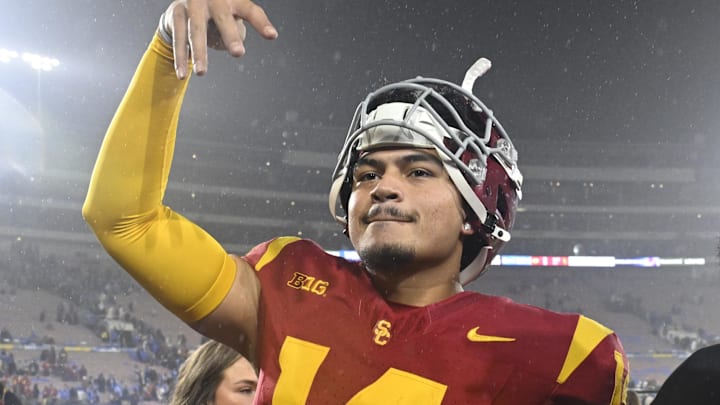 Nov 23, 2024; Pasadena, California, USA; USC Trojans quarterback Jayden Maiava (14) celebrates the win over UCLA at Rose Bowl. Mandatory Credit: Robert Hanashiro-Imagn Images Nov 23, 2024; Pasadena, California, USA; USC Trojans quarterback Jayden Maiava (14) celebrates the win over UCLA at Rose Bowl. Mandatory Credit: Robert Hanashiro-Imagn Images