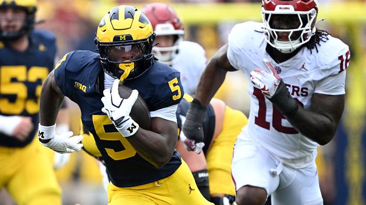 Sep 12, 2026; Ann Arbor, Michigan, USA; Michigan Wolverines running back Savion Hiter (5) carries the ball against the Oklahoma Sooners during the first quarter at Michigan Stadium. Mandatory Credit: Lon Horwedel-Imagn Images Sep 12, 2026; Ann Arbor, Michigan, USA; Michigan Wolverines running back Savion Hiter (5) carries the ball against the Oklahoma Sooners during the first quarter at Michigan Stadium. Mandatory Credit: Lon Horwedel-Imagn Images