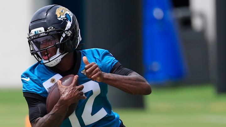 Jacksonville Jaguars wide receiver Travis Hunter (12) runs the ball during a rookie minicamp at Miller Electric Center Saturday, May 10, 2025 in Jacksonville, Fla. [Corey Perrine/Florida Times-Union]