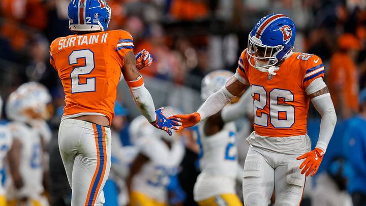 Jan 4, 2026; Denver, Colorado, USA; Denver Broncos cornerback Pat Surtain II (2) reacts with safety Devon Key (26) after a play in the fourth quarter against the Los Angeles Chargers at Empower Field at Mile High. Mandatory Credit: Isaiah J. Downing-Imagn Images Jan 4, 2026; Denver, Colorado, USA; Denver Broncos cornerback Pat Surtain II (2) reacts with safety Devon Key (26) after a play in the fourth quarter against the Los Angeles Chargers at Empower Field at Mile High. Mandatory Credit: Isaiah J. Downing-Imagn Images
