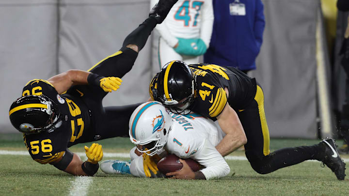 Miami Dolphins quarterback Tua Tagovailoa (1) is sacked by Pittsburgh Steelers linebacker Payton Wilson (41) and linebacker Alex Highsmith (56) in the third quarter at Acrisure Stadium. Miami Dolphins quarterback Tua Tagovailoa (1) is sacked by Pittsburgh Steelers linebacker Payton Wilson (41) and linebacker Alex Highsmith (56) in the third quarter at Acrisure Stadium.