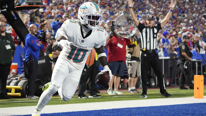 Miami Dolphins WR Tyreek Hill scores a touchdown against the Buffalo Bills in the fourth quarter at Highmark Stadium.