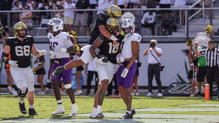 Sep 26, 2026; Orlando, Florida, USA; UCF Knights tight end Caden Piening (18) celebrates after scoring during the second quarter against the TCU Horned Frogs at Acrisure Bounce House. Mandatory Credit: Mike Watters-Imagn Images Sep 26, 2026; Orlando, Florida, USA; UCF Knights tight end Caden Piening (18) celebrates after scoring during the second quarter against the TCU Horned Frogs at Acrisure Bounce House. Mandatory Credit: Mike Watters-Imagn Images