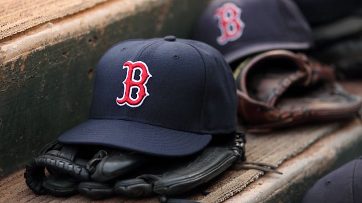 Aug 23, 2011; Arlington, TX, USA; Hats and gloves from the Boston Red Sox team near the edge of the dugout before the game against the Texas Rangers at Rangers Ballpark. Mandatory Credit: Kevin Jairaj-Imagn Images Aug 23, 2011; Arlington, TX, USA; Hats and gloves from the Boston Red Sox team near the edge of the dugout before the game against the Texas Rangers at Rangers Ballpark. Mandatory Credit: Kevin Jairaj-Imagn Images