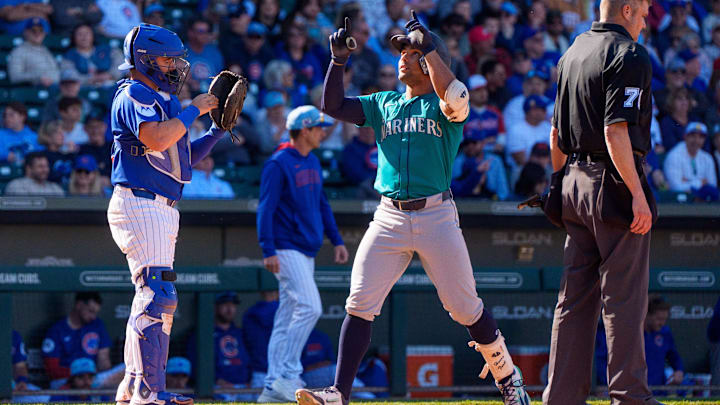 Seattle Mariners catcher Harry Ford (center) reacts after hitting a home run in a spring training game against the Chicago Cubs on March 8 at Sloan Park.