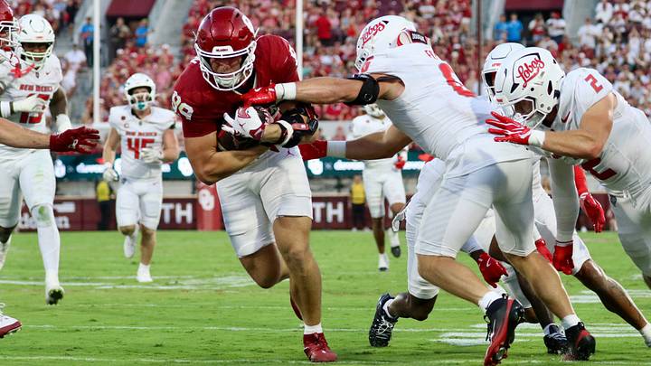 Oklahoma tight end Hayden Hansen fights through tackles to score a touchdown against New Mexico. Oklahoma tight end Hayden Hansen fights through tackles to score a touchdown against New Mexico.