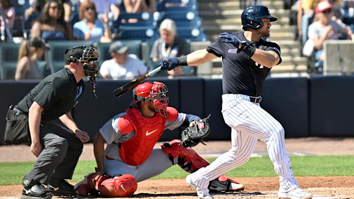 Feb 26, 2025; Tampa, Florida, USA; New York Yankees left fielder Jasson Dominguez (24) hits a RBI single in the third inning against the St. Louis Cardinals during spring training at George M. Steinbrenner Field. Feb 26, 2025; Tampa, Florida, USA; New York Yankees left fielder Jasson Dominguez (24) hits a RBI single in the third inning against the St. Louis Cardinals during spring training at George M. Steinbrenner Field.