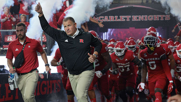 Sep 24, 2022; Piscataway, New Jersey, USA; Rutgers Scarlet Knights head coach Greg Schiano leads the Scarlet Knights football team onto the field before a game against the Iowa Hawkeyes at SHI Stadium. Mandatory Credit: Vincent Carchietta-Imagn Images