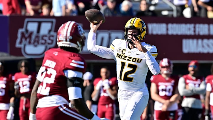 Oct 12, 2024; Amherst, Massachusetts, USA; Missouri Tigers quarterback Brady Cook (12)  throws a pass during the second half against the Massachusetts Minutemen at Warren McGuirk Alumni Stadium. Mandatory Credit: Eric Canha-Imagn Images