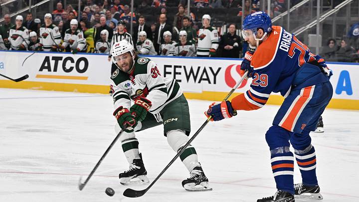 Dec 2, 2025; Edmonton, Alberta, CAN; Minnesota Wild right wing Ryan Hartman (38) fights for the puck with Edmonton Oilers center Leon Draisaitl (29) during the second period at Rogers Place. Mandatory Credit: Walter Tychnowicz-Imagn Images Dec 2, 2025; Edmonton, Alberta, CAN; Minnesota Wild right wing Ryan Hartman (38) fights for the puck with Edmonton Oilers center Leon Draisaitl (29) during the second period at Rogers Place. Mandatory Credit: Walter Tychnowicz-Imagn Images