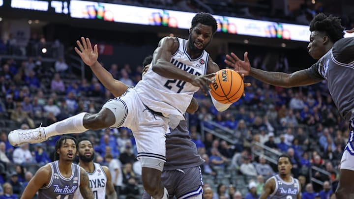 Feb 7, 2024; Newark, New Jersey, USA; Georgetown Hoyas forward Supreme Cook (24) shoots the ball as Seton Hall Pirates guard Kadary Richmond (1) defends during the first half at Prudential Center. Mandatory Credit: Vincent Carchietta-Imagn Images