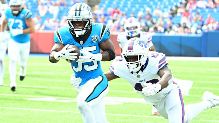 Aug 24, 2024; Orchard Park, New York, USA; Carolina Panthers running back Jaden Shirden (35) tries to break free from Buffalo Bills linebacker Edefuan Ulofoshio (48) after making a catch