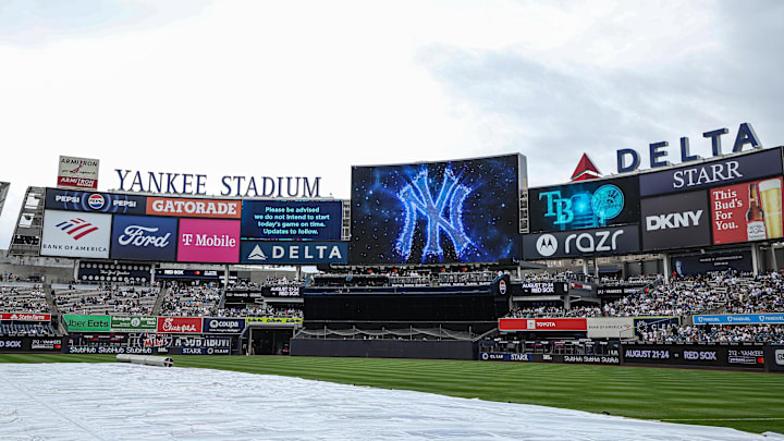May 4, 2025; Bronx, New York, USA; A rain delay message is displayed on the main scoreboard  before the game against the Tampa Bay Rays at Yankee Stadium. Mandatory Credit: Vincent Carchietta-Imagn Images
