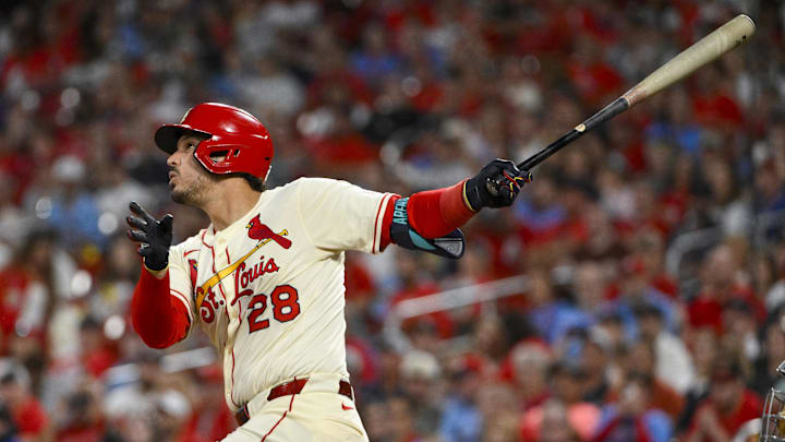Sep 20, 2025; St. Louis, Missouri, USA; St. Louis Cardinals third baseman Nolan Arenado (28) hits a one run single against the Milwaukee Brewers during the fourth inning at Busch Stadium. Mandatory Credit: Jeff Curry-Imagn Images
