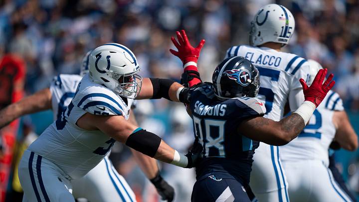 Indianapolis Colts guard Quenton Nelson (56) stops Tennessee Titans defensive tackle Jeffery Simmons (98) from getting to the quarterback during the first quarter their game at Nissan Stadium in Nashville, Tenn., Sunday, Oct. 13, 2024. Indianapolis Colts guard Quenton Nelson (56) stops Tennessee Titans defensive tackle Jeffery Simmons (98) from getting to the quarterback during the first quarter their game at Nissan Stadium in Nashville, Tenn., Sunday, Oct. 13, 2024.